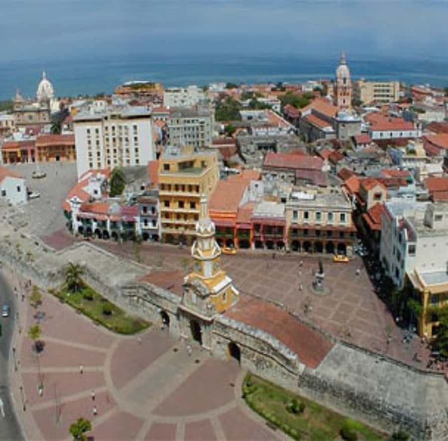 Cartagena City Tour with San Felipe Castle & Old Town Walk - Plaza de la Aduana and Cartagena’s difficult past