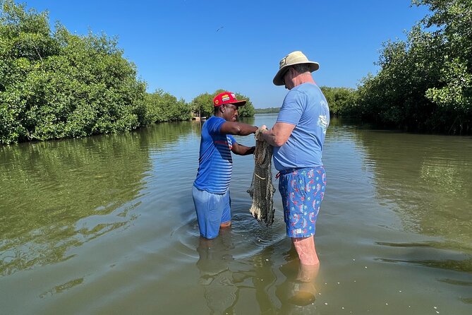 Cartagena Fishing & Crabbing • Unique Local Experience with Lunch - Canoeing beneath the mangrove canopy