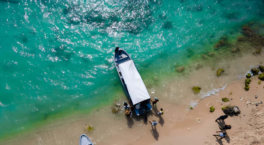 Cartagena: Tour to Playa Tranquila with Snorkeling + Luminous Plankton and Parasol - From Cartagena to Barú by bus and boat