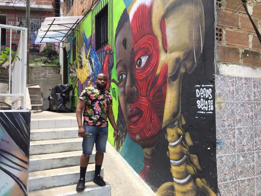 Comuna 13 Neighborhood & Street Art Private Tour - Walking through Comuna 13’s public art