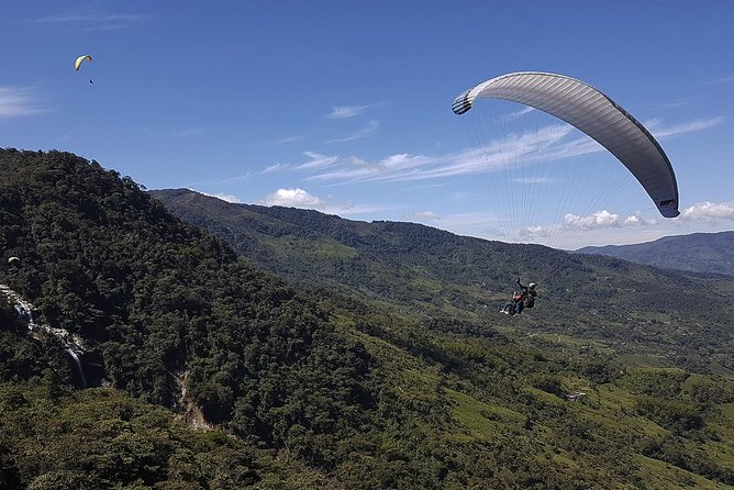 Fun RAFTING + Awesome PARAGLIDING over giant waterfalls from MEDELLIN - From Medellín to Cocorná by Private Car