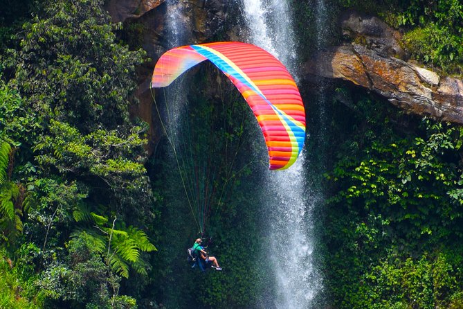 Fun RAFTING + Awesome PARAGLIDING over giant waterfalls from MEDELLIN - Class IV Rafting on the River