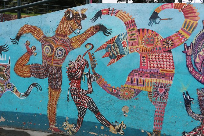Graffiti Tour in La Candelaria Bogotá with Transportation - A narrow street filled with indigenous stories
