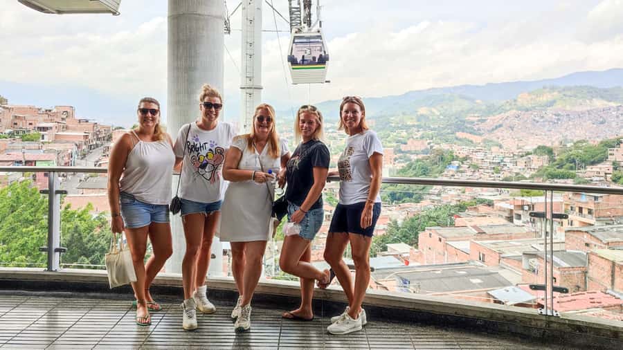 Medellin: Comuna 13 Graffiti Tour, Cable Car & Street Food - Reading the murals instead of just photographing them