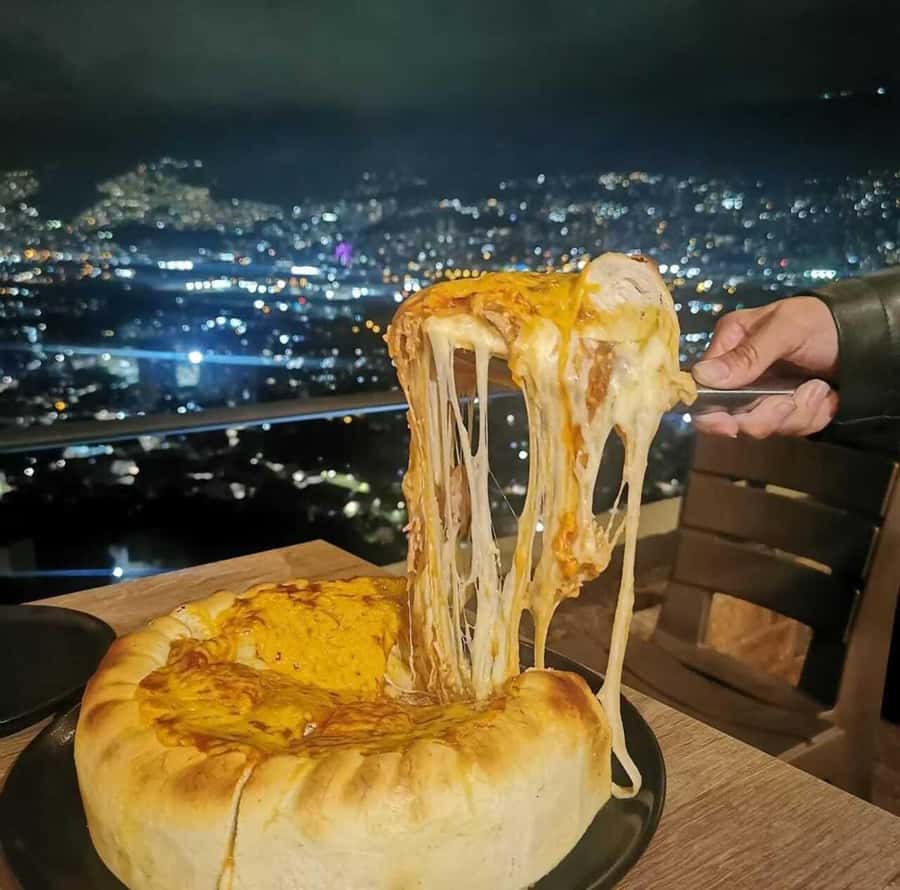 Medellin: tasting Street Food with Rooftops of El Poblado - Empanaditas El Poblado and the quick walking rhythm