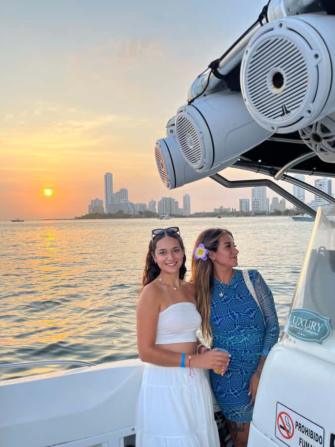 Sunset Party open bar on the bay while sharing with locals - The first cruise through Cartagena Bay