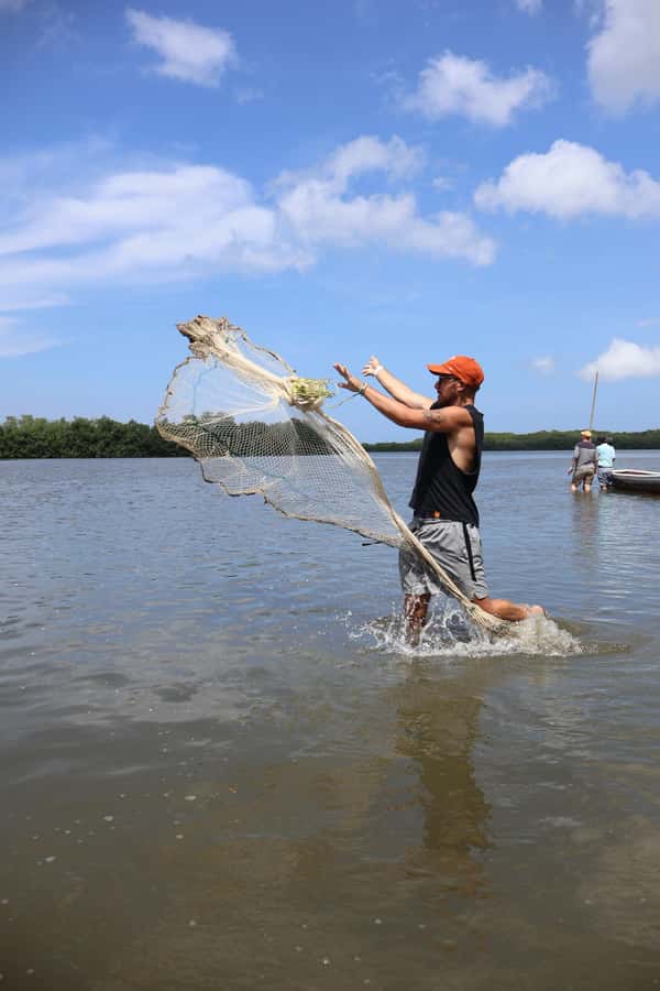 Typical lunch on beach, mangrove tour & fishing with natives - Fisherman Island and community life